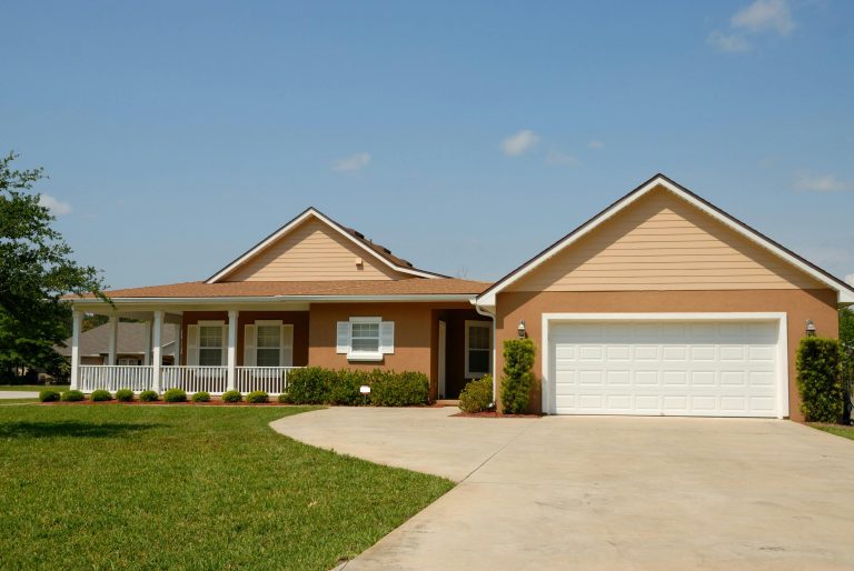 outside of a house - Signs It’s Time to Replace Your Air Conditioner